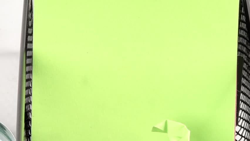 Quality versus Quantity on a green sticky note, with elegant desk accessories in a clean, bright workspace.