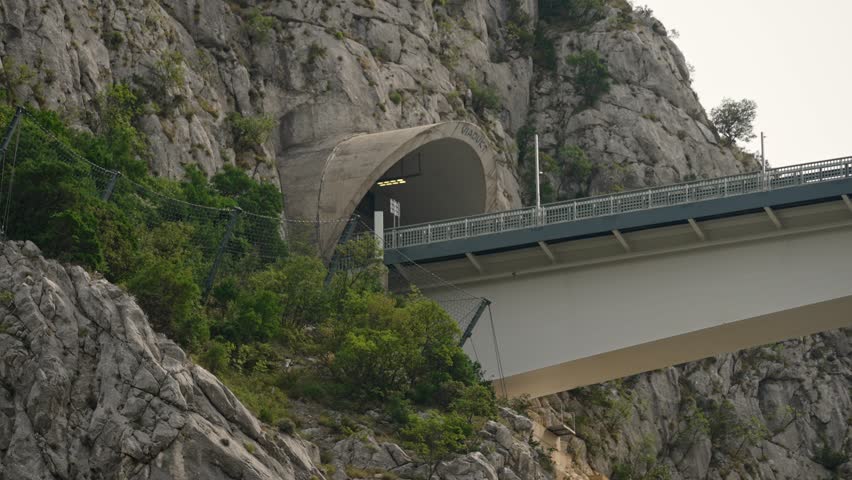 Modern high altitude bridge over mountain canyon.