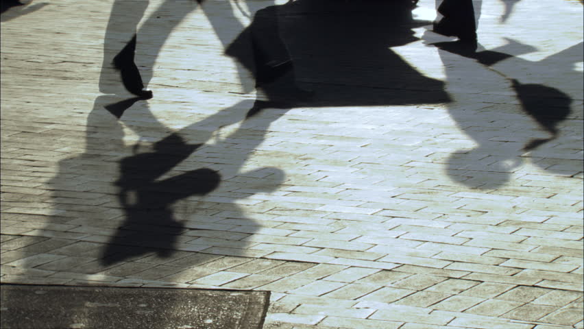 time lapse of silhouettes and shadows people walking