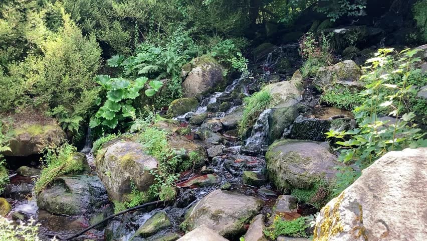 Waterfall and little stream in the Mountain Park, Kassel, Germany