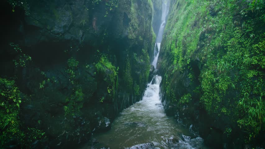 4K Aerial view of Saatsada waterfall in narrow valley in Sahyadri mountain range, Maharashtra, India. Nature landscape. travel, holidays, vacation, trekking and adventure concept. 