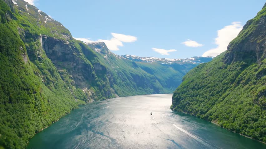 Seven Sisters Waterfall, Geiranger Fjord, Norway. Nature in fjords. Traveling through the Norwegian fjords. Scandinavia. View of nature from the drone. Vacation and travel in summer Norway.