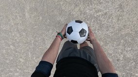 Man performing soccer freestyle tricks, juggling and controlling a football with his feet. First person pov of athletic skill and practice - Powered by Shutterstock - Get 15% off with code: PIKWIZARD15