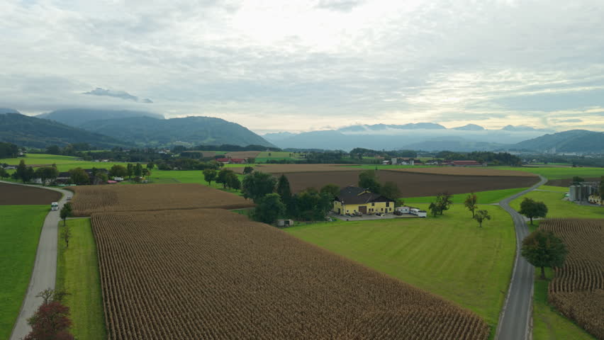 Aerial view of Alps and farmhouse in Laakirchen, Upper Austria