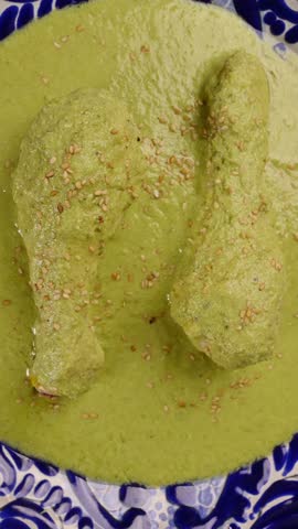 Traditional Mexican food with heritage, green pipian, camera slowly rotating