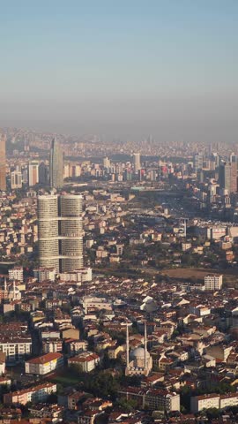 Aerial view of Istanbul skyline with modern skyscrapers and traditional residential buildings in Turkey at sunrise