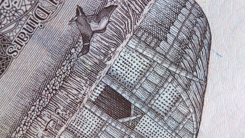 This macro video showcases the detailed reverse side of the 50,000 Iraqi Dinar banknote. The camera pans across the intricate engravings, highlighting the "Mudhif," a traditional reed house of the Marsh Arabs, alongside a flying duck and a map of Iraq featuring the Tigris and Euphrates rivers. The footage emphasizes the fine lines of the intaglio printing, the textured security paper, and the cultural symbols that represent the heritage of southern Iraq’s wetland ecosystems.