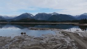 Serene Mountain Lake Reflecting Snowy Peaks in British Columbia, Canada - Powered by Shutterstock - Get 15% off with code: PIKWIZARD15