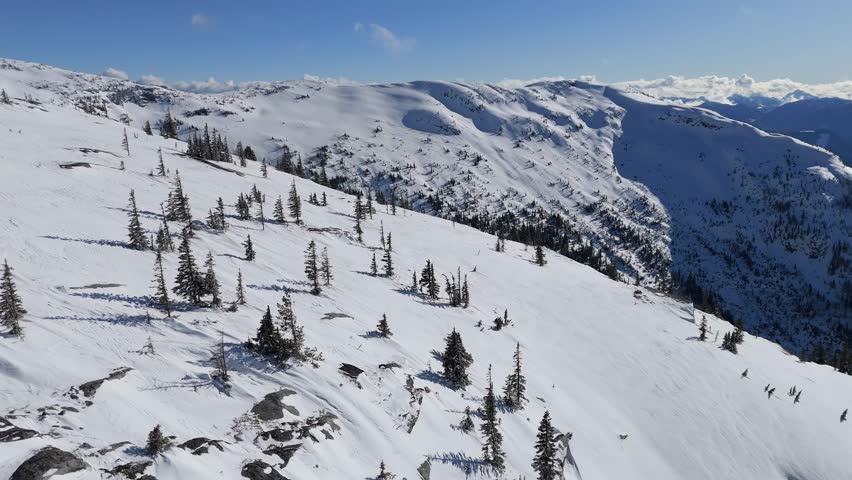 Majestic Winter Landscape of Snow-Covered Mountains and Pine Forests in British Columbia, Canada