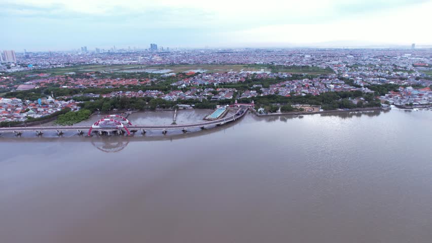 Suroboyo Bridge also known as the Kenjeran Bridge in Surabaya, Indonesia Aerial View of Suroboyo Bridge at Dawn Kenjeran Coastal Landmark Modern Infrastructure in East Java