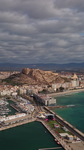 Aerial view of Alicante marina beach and Santa Barbara Castle on Costa Blanca Spain.