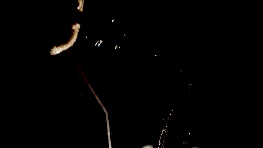 Close up video of musician man playing saxophone. Low light and selective focus. Saxophone player closeup video