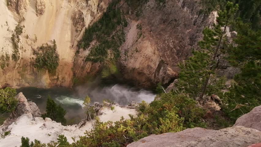 Scenic View Of Cliffs And Flowing Water. Vast Canyon With Rushing Waterfall And Pinelined Banks