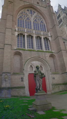 Majestic view of the historic Sint Salvatorskathedraal, the main church of Bruges. The clip shows its Gothic architecture and stone statues