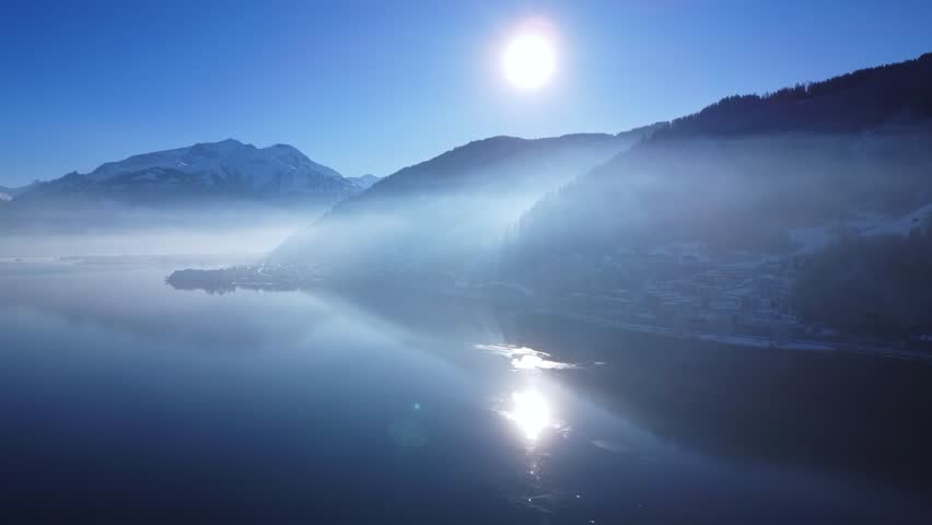Experience the breathtaking winter majesty of the Austrian Alps from an entirely new perspective. This cinematic drone collection takes you on a high-altitude journey across some of the most iconic alpine regions in Austria: the vast slopes of Saalbach Hinterglemm, the dramatic glacier landscapes of the Kaunertal, the sun-drenched plateaus of Serfaus-Fiss-Ladis, and the stunning mountain-meets-lake panorama of Zell am See.

Filmed under perfect conditions, these shots showcase the Alps at their most spectacular. Every frame has been captured with professional-grade stabilization to ensure buttery-smooth motion, from sweeping orbits around jagged limestone peaks to slow, meditative glides over pristine powder fields. To bring out the soul of the landscape, the footage has undergone a professional color grading process, enhancing the deep sapphire blues of the alpine sky, the brilliant whites of the fresh snow, and the warm, golden hues of the winter sun hitting the ridges.

Whether it is the rhythmic patterns of freshly groomed corduroy on the world-class ski runs of Serfaus-Fiss-Ladis, the epic scale of the Kaunertal glacier roads, or the peaceful stillness of a frozen Lake Zell, this footage captures the essence of a European winter wonderland. You will see traditional alpine chalets tucked into snowy valleys, modern cable cars ascending towards the clouds, and the infinite horizon of the Hohe Tauern and Northern Limestone Alps.

Designed for travel documentaries, high-end commercial projects, or atmospheric relaxation films, this footage provides a majestic bird