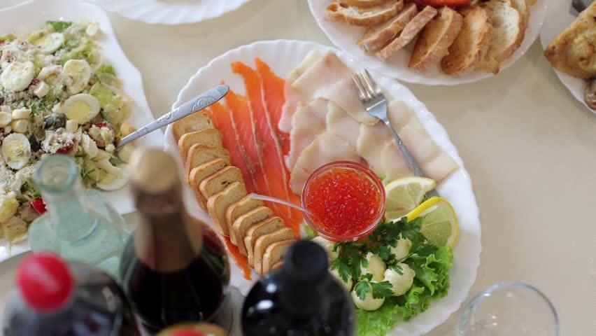 Banquet table, there are different dishes at the celebration. Many delicious snacks