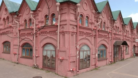 Drone Orbiting Corner Red Brick Building