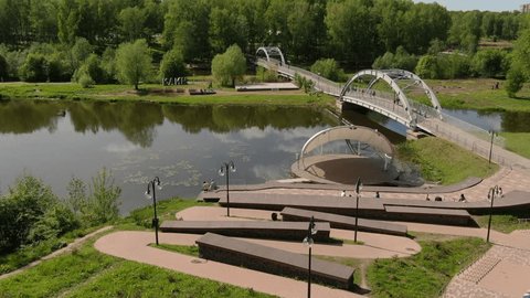 Drone Flying Forward over River Bridge