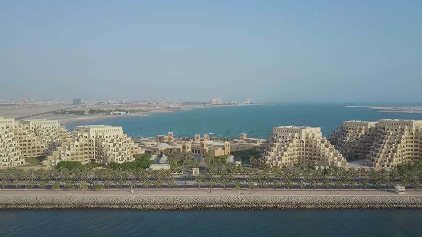 Majestic Aerial View of Marjan Island, Luxury Resorts and Stepped Architecture in Ras Al Khaimah, UAE. Moderen Pyramid architecture of Bab al Bar in Ras al Khaima UAE. 