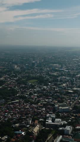 Davao City with residential area and modern buildings. Mindanao, Philippines. Vertical view.