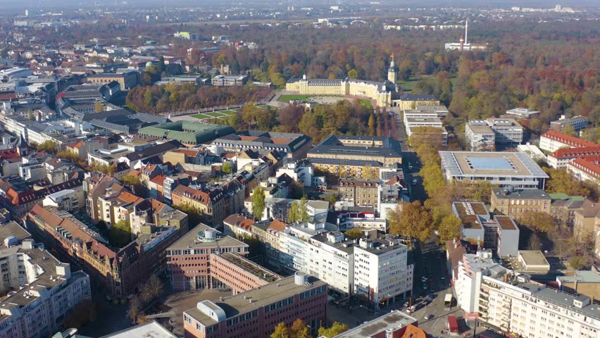 Aerial view around the old town and downtown of the city Karlsruhe on a sunny autumn noon.