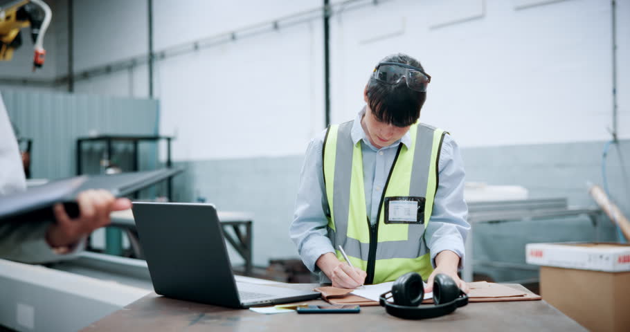 Woman, engineer and typing with laptop at warehouse for research, machine update or technical guide. Person, pc or production manual, automation information and diagnostics document for manufacturing