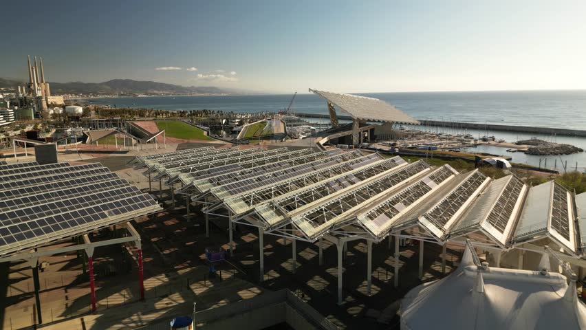 parc del forum aerial view with solar photovoltaic panels and mediterranean sea on a sunny day, modern urban architecture