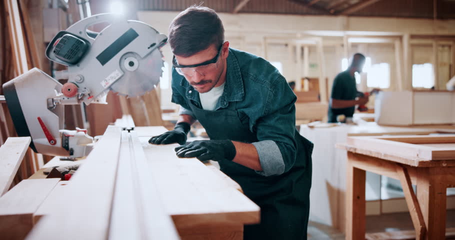 Woodworking, measure and man in workshop for project, planning or manufacturing furniture. Industry, small business and male carpenter with timber material and saw machine for production in factory.