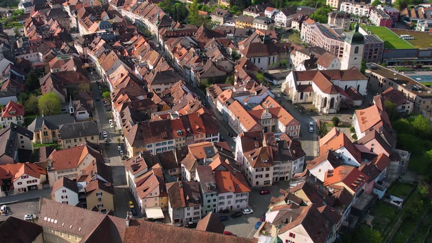 Aerial panorama view of the old town in the city Porrentruy in Switzerland on a sunny noon in summer.