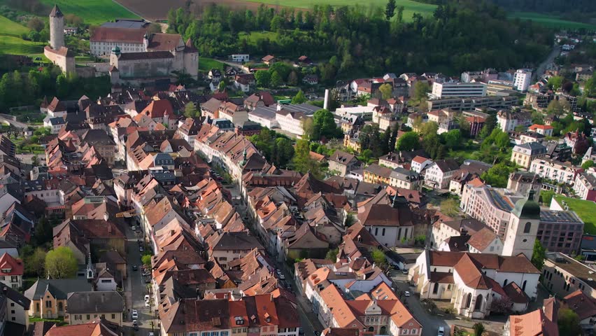 Aerial panorama view of the old town in the city Porrentruy in Switzerland on a sunny noon in summer.