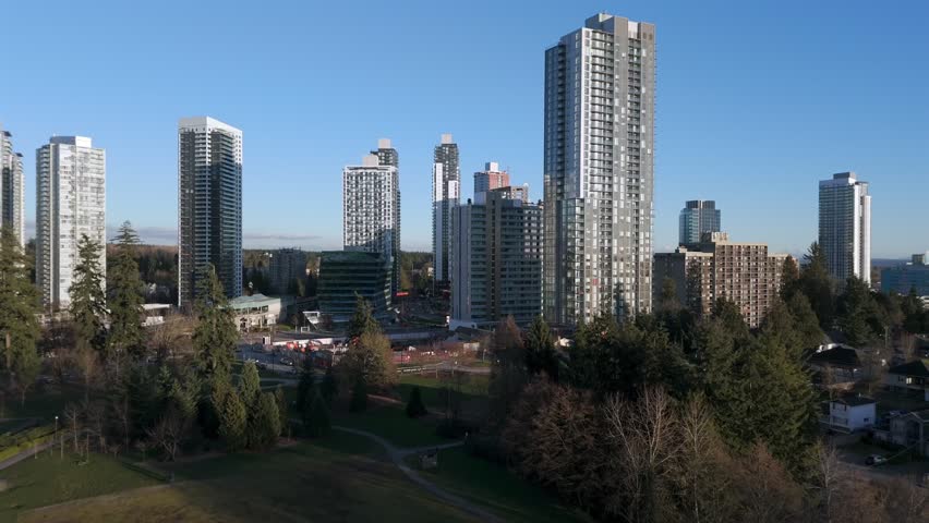 Modern City With Towering Residential Buildings At Surrey City Centre In British Columbia, Canada. Aerial Shot