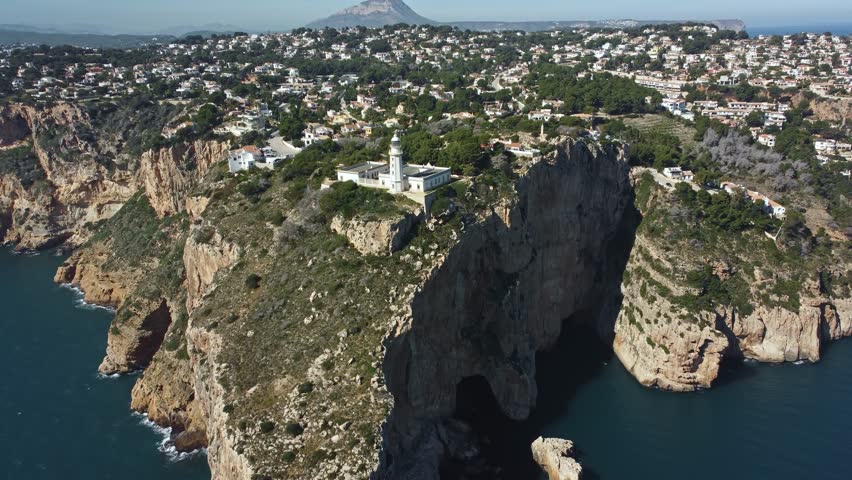 Mediterranean coastal landscape with Cabo de la Nau lighthouse, Spain.