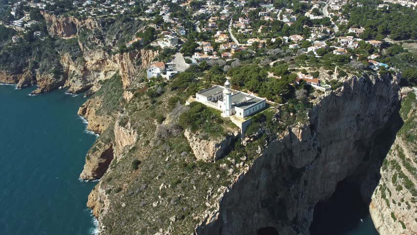 Cabo de la Nau cliffs and lighthouse, Spain, drone view