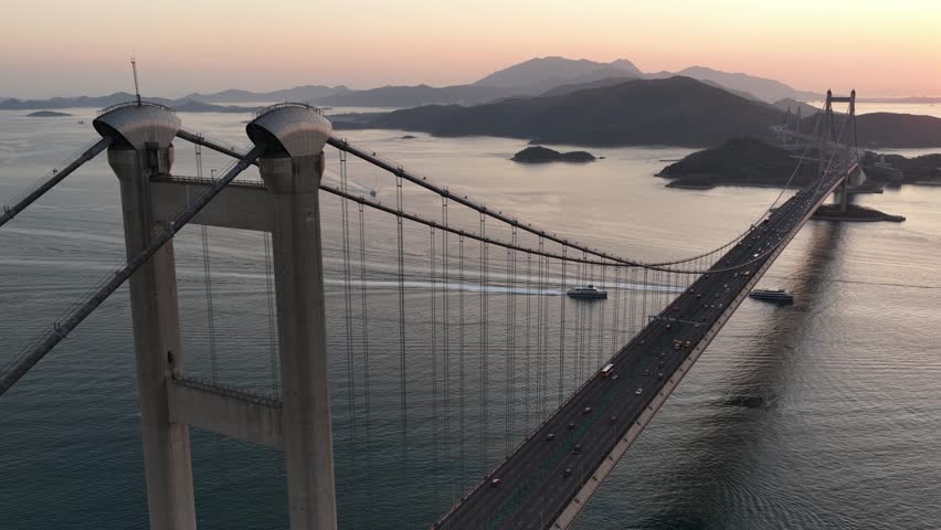 Aerial view of tsing ma bridge traffic at sunset in hong kong