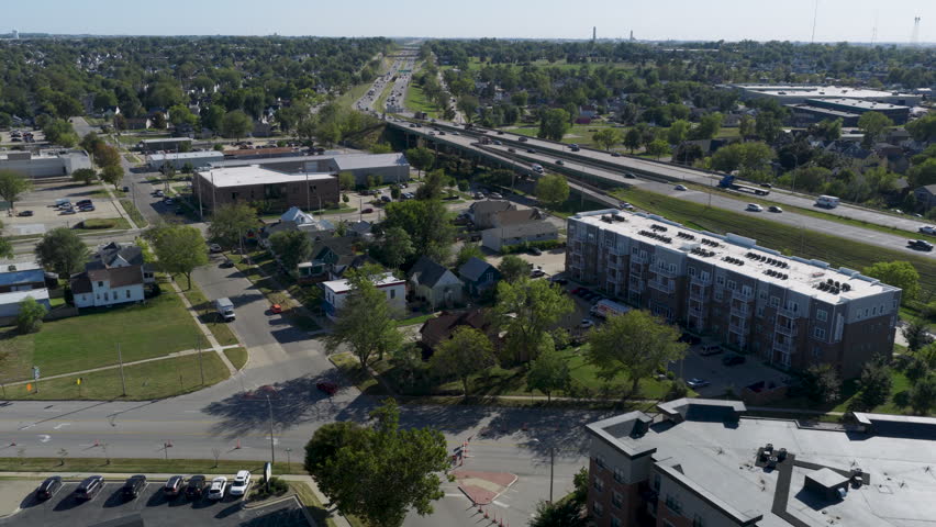 Residential neighborhood and highway interchange in Cedar Rapids Iowa with houses and traffic, suburban midwest lifestyle