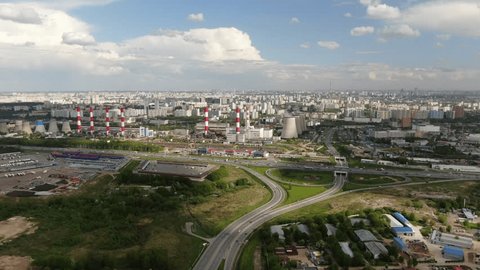 Drone Flying Forward over City Power Plant