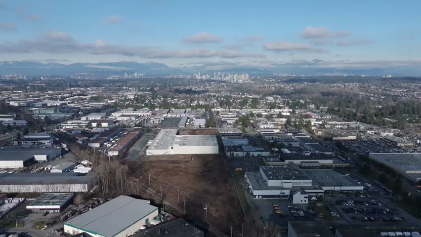 Dense Urban Or Industrial Area With Commercial Buildings In Surrey, British Columbia, Canada - Aerial Drone Shot