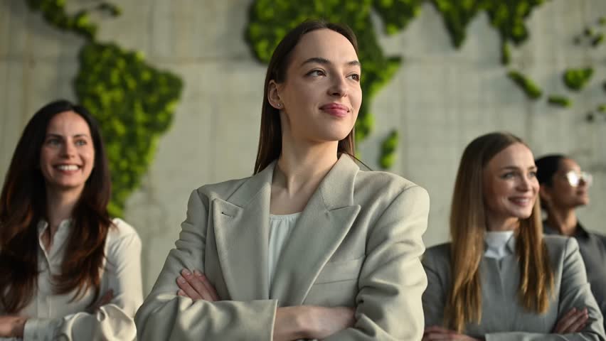 Group of diverse successful businesswomen looking forward with optimism. Female leadership and teamwork in a sustainable company