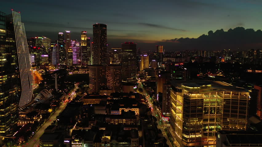 sunset sky night time illumination singapore city downtown traffic street aerial panorama 4k