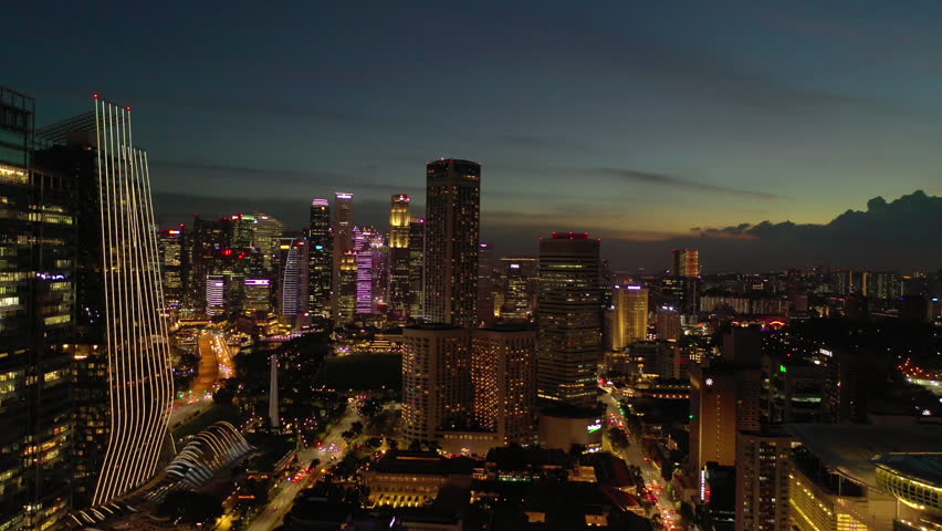 sunset sky night time illumination singapore city downtown traffic street aerial panorama 4k