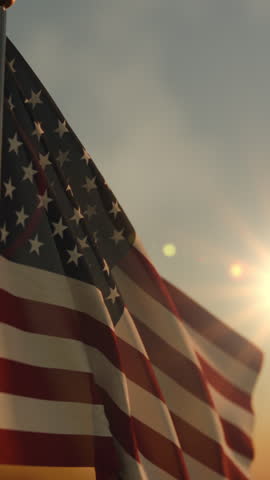 Slow American flag at sunset during Memorial Day in the United States