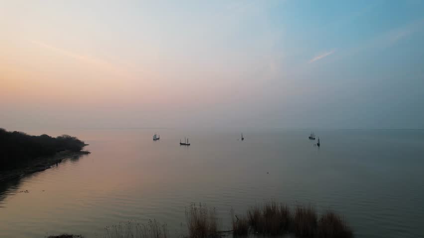 Sunset Over Taihu Lake with Boat Reflections Natural Scenery Aerial View