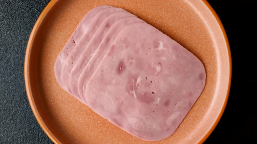 Meat, square ham sliced, organic food, protein for snacks. Sliced ham as a food background for your design