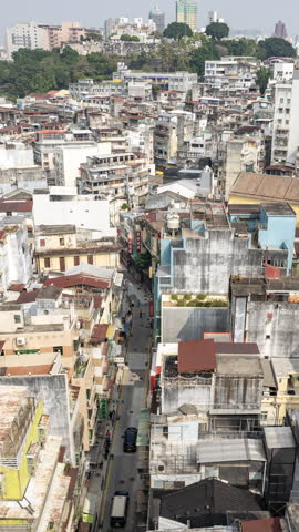 timelapse of the old macau skyline in daytime in vertical
