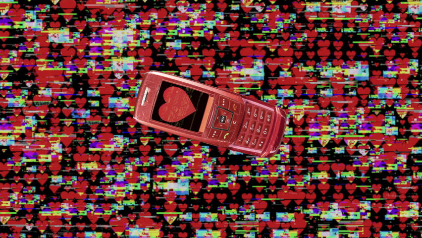 red retro mobile telephones with glitching heart on the screen