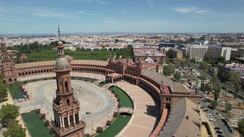 Aerial drone footage of Plaza de España in Seville, Spain, showcasing its grand architecture and water features