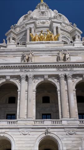 The Minnesota State Capitol in St Paul highlighting its design and structure during bright weather.