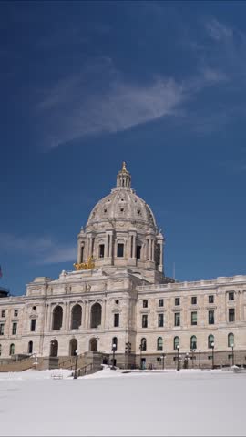 The State Capitol in St Paul Minnesota with clear views of the building and its environment on a winter day.