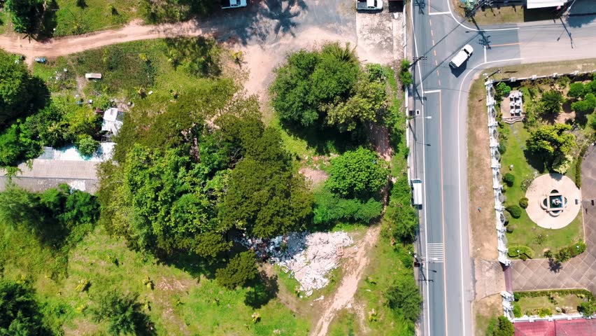 Aerial Siray Bay village Phuket Thailand road top down