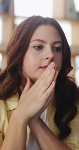 Nervous, thinking and woman with stress in home for regret, ponder and reflection of mistake. Mental health, person with depression and thoughtful on sofa with worry, pensive and doubt with decision